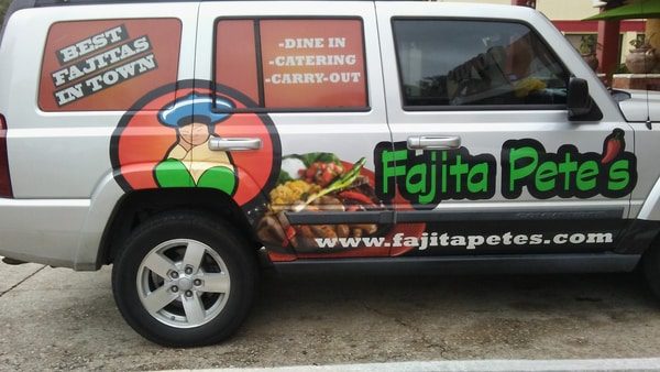 White van with a car wrap for Fajita Pete