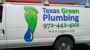 White work truck with green and blue decals for plumbing company