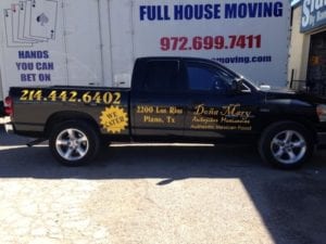 Black work truck with yellow decals for Mexican food restaurant