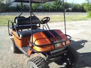 Orange golf cart with black vinyl decals