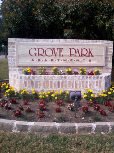 Wood and bridge sign for an apartment complex