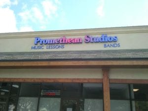 Storefront sign for Promethean Studios
