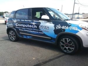 Hatchback car with vinyl decal car wrap for computer company