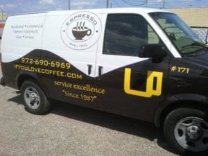 Black and white van with vinyl decals for espresso coffee company