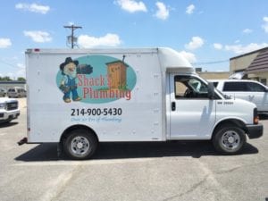 White moving truck with vinyl decals for plumbing company