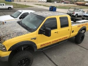 Yellow F250 work truck with red vinyl decal lettering for Brown Construction
