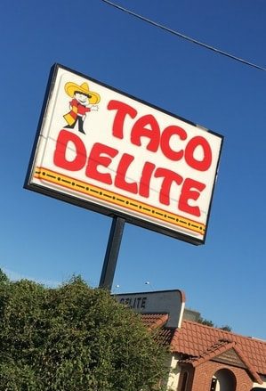 Large billboard sign for taco restaurant