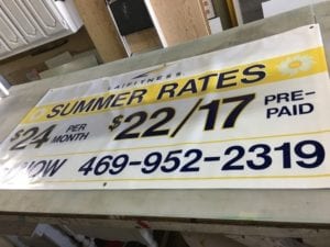 Large banner advertising LA Fitness's summer rates