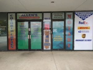 Multiple colorful vinyl window decals for postal center business