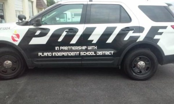 White SUV with decals for the Plano ISD Police