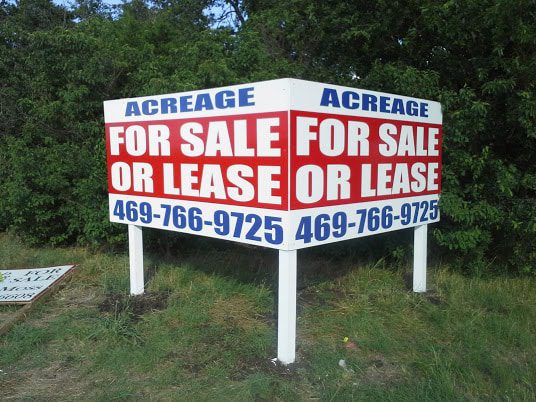 Two-sided billboard for land acreage
