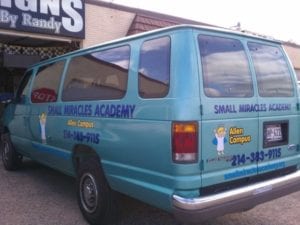 Blue transport van with vinyl decals for a children's academy