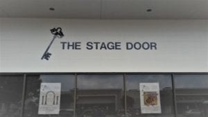 Storefront sign for The Stage Door