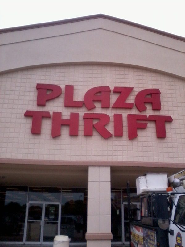 Storefront sign for Plaza Thrift