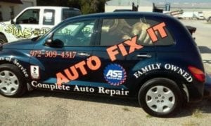 Dark colored SUV with decals for auto repair company