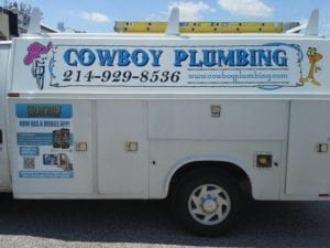 White work truck with vinyl decals for Cowboy Plumbing company