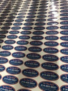Rows of red, white, and blue oval stickers
